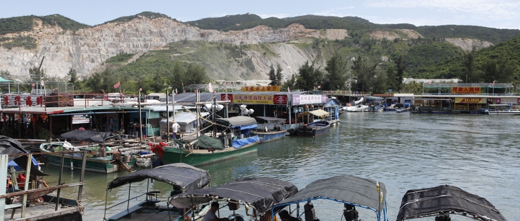 Boats wait for customers down by Houhai Pier, China